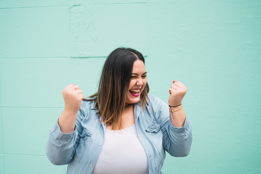 Young,Plus,Size,Woman,Celebrating,Victory.