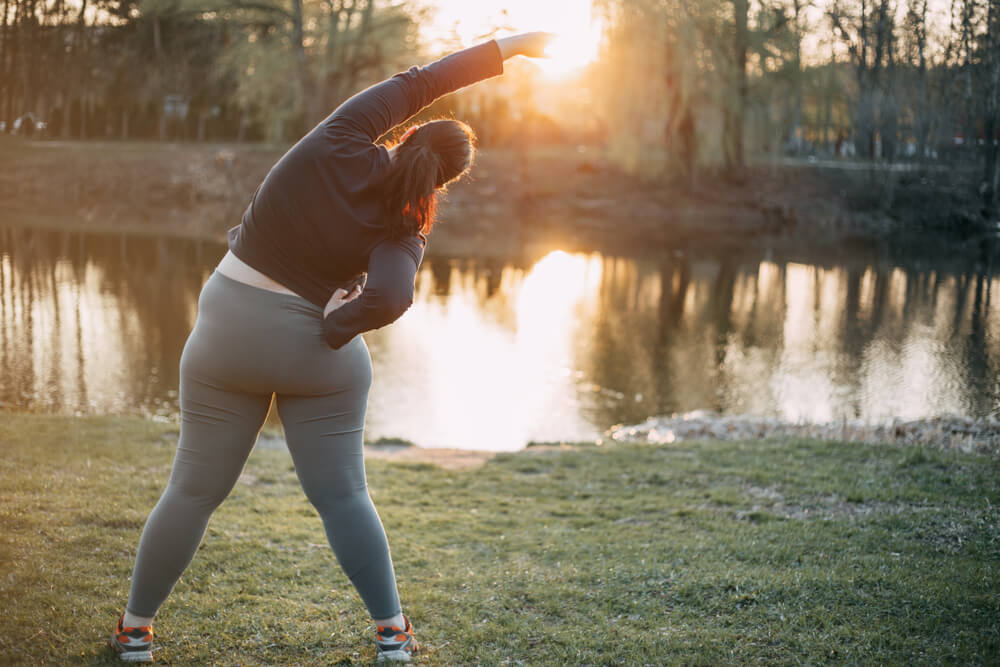 Morning,Yoga.,Young,Woman,Doing,Exercises,Near,The,Lake,back,View. eating out after bariatric surgery